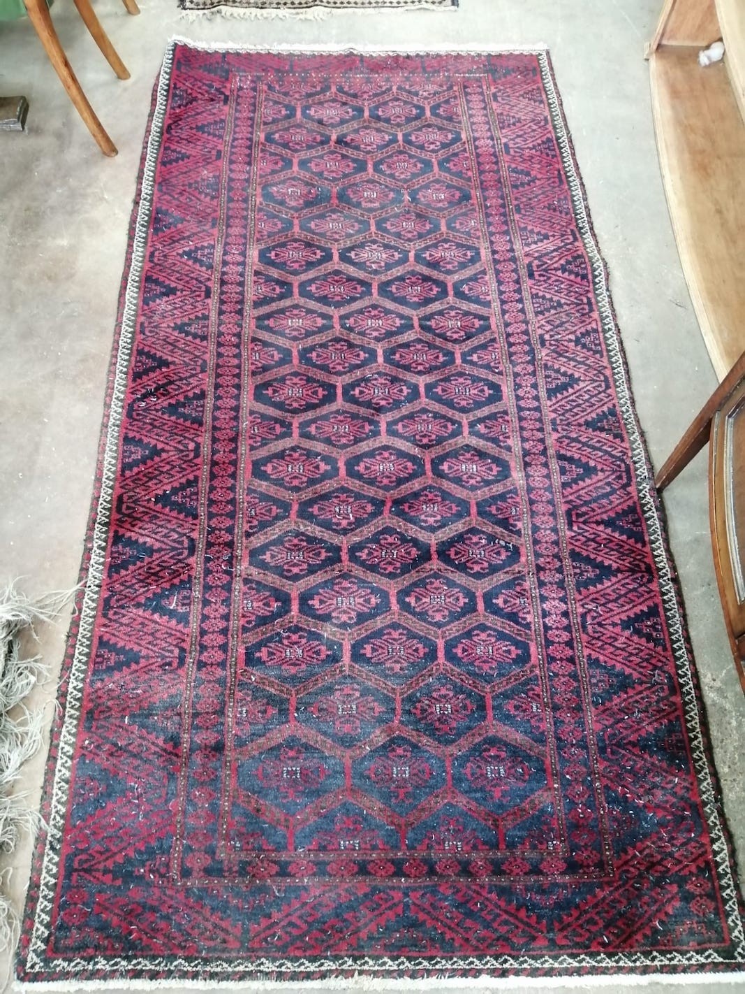 A Belouch rug and a North West Persian rug, larger 220 x 110cm